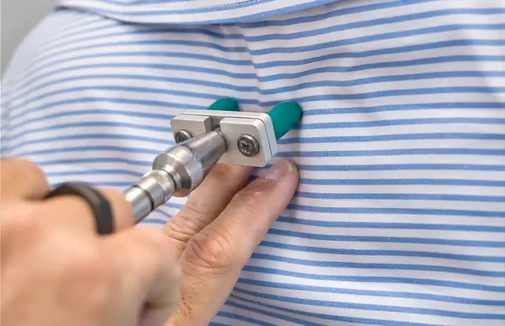 Close up view of Chiropractor applying a targeted contact adjustment